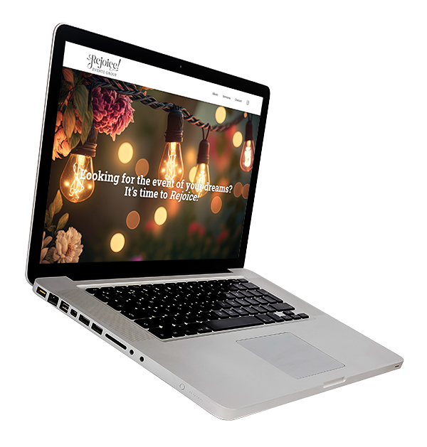 A laptop computer is open to a website with flowers and lights on the screen.