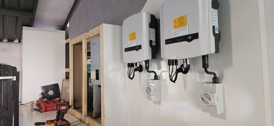 2 solar batteries mounted inside a house — Innovo Electrical & Solar In Thebarton, SA