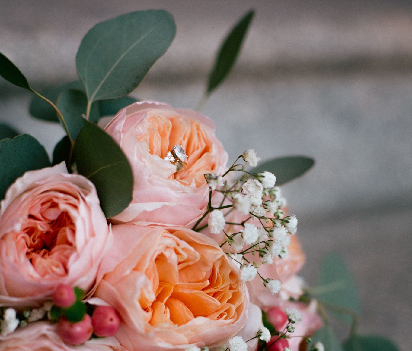 A wedding bouquet featuring peach garden roses.