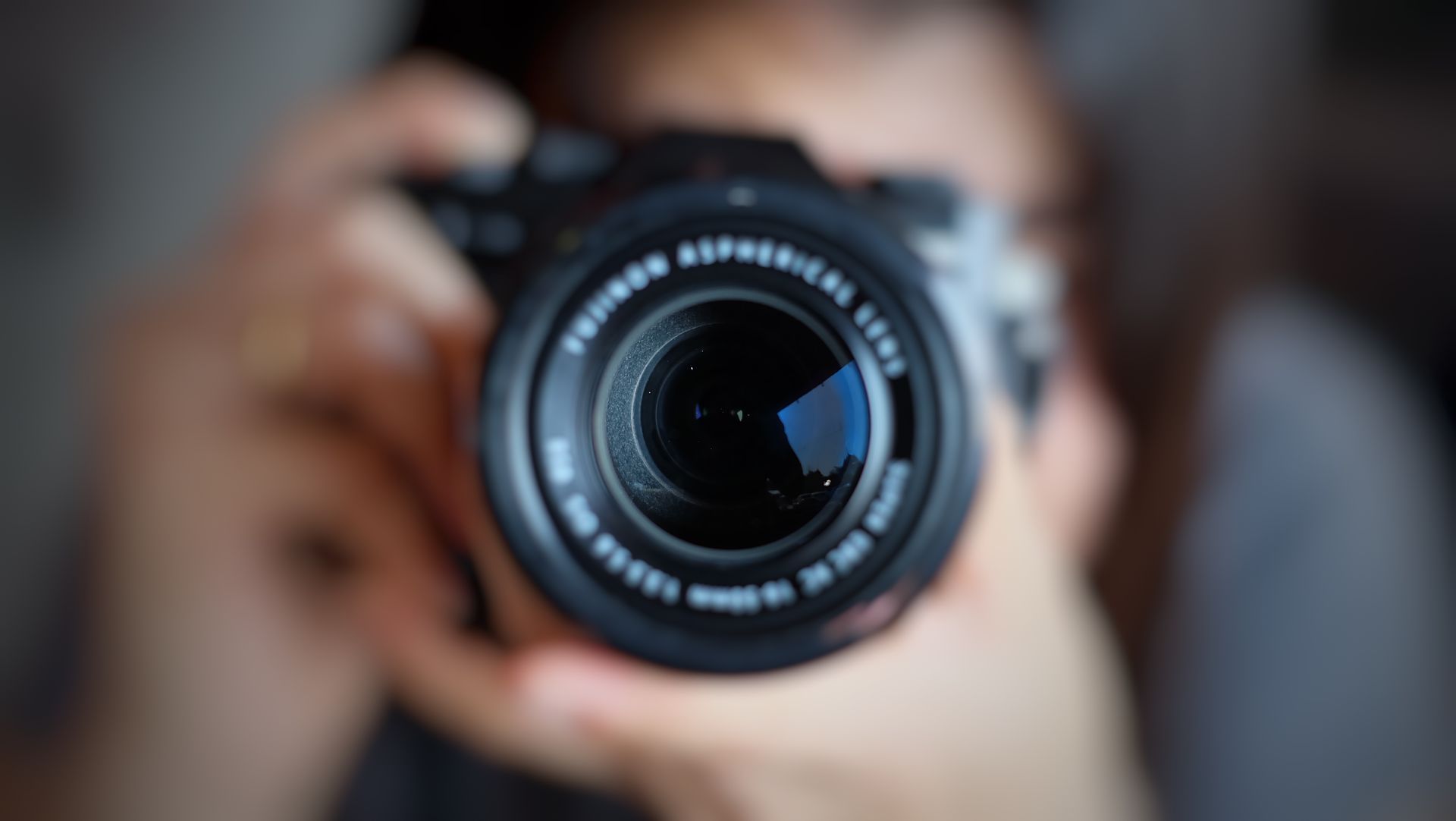 Person holding a camera.