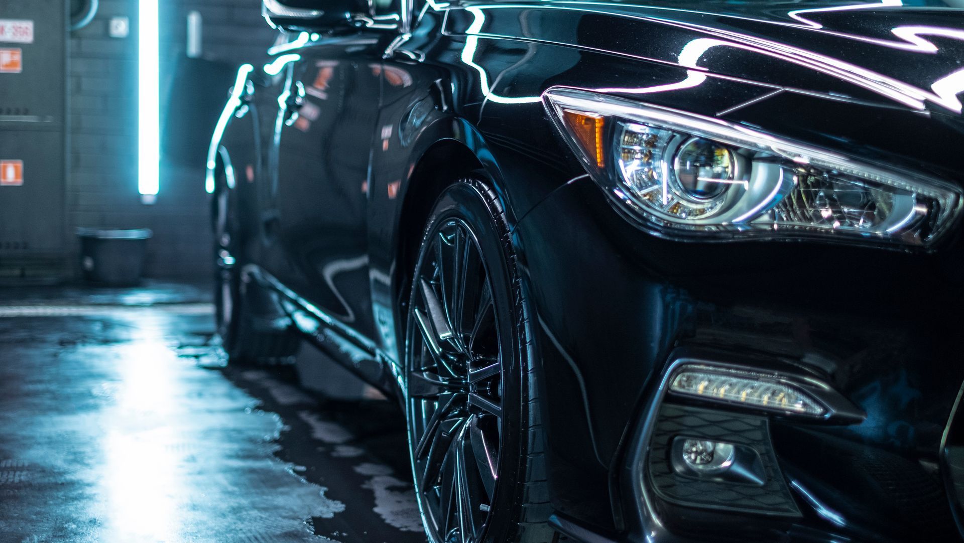 Black car in a car wash.