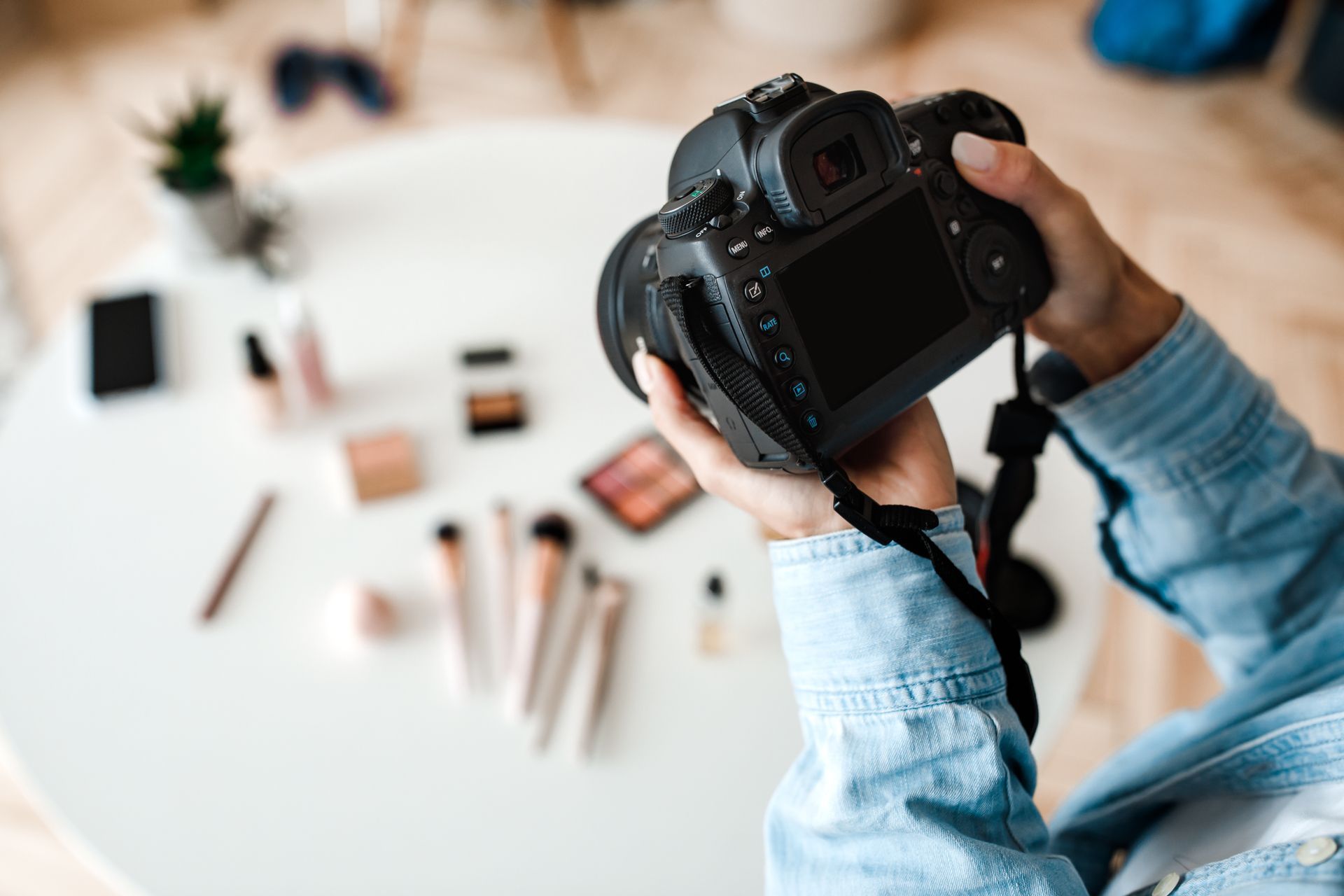 Person holding a camera.