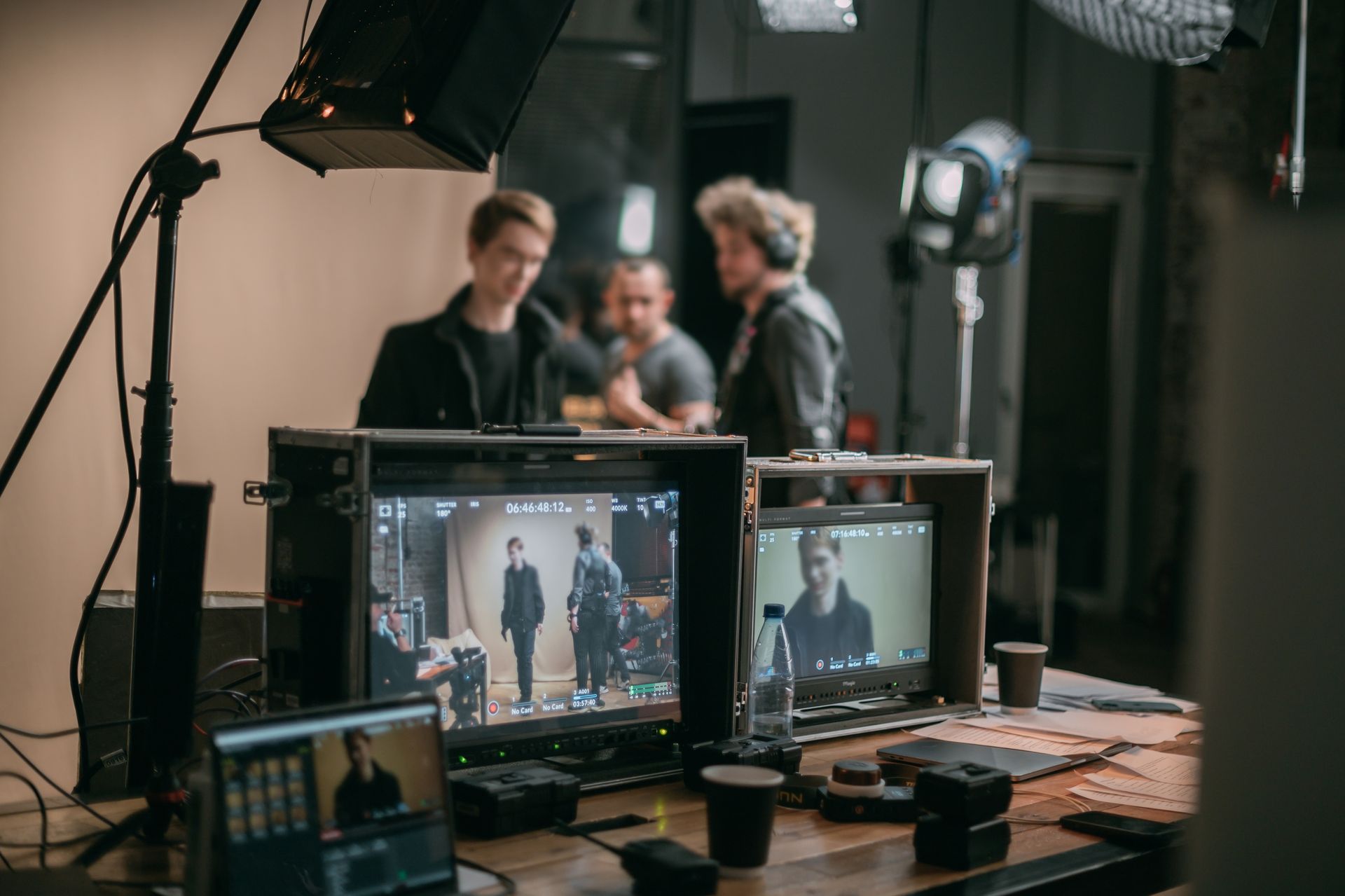 Film set: monitors showing actors.