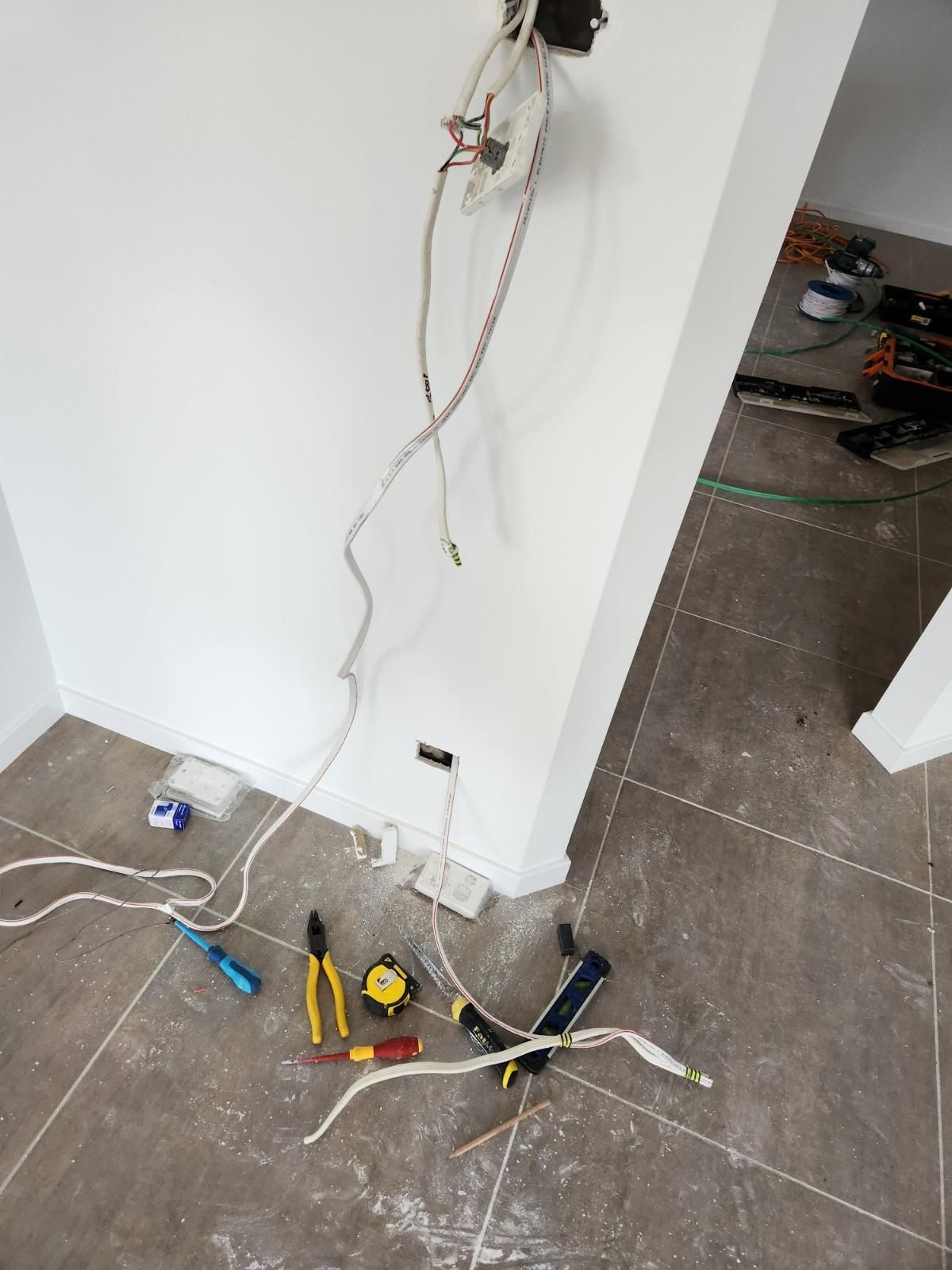 A Bunch of Wires Are Laying on The Floor in A Room — All Star Electrical Services in Wollongong, NSW