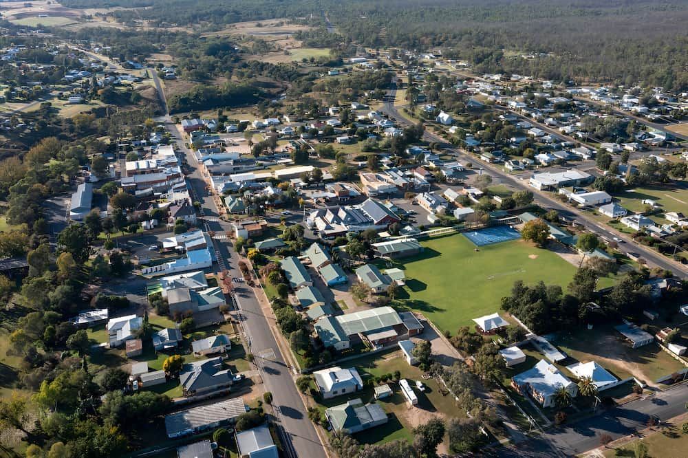 An Aerial View Of A Small Town With Lots Of Houses And Trees — All Star Electrical Services in Unanderra, NSW