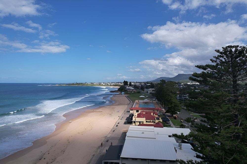 An Aerial View Of A Beach With A City — All Star Electrical Services in Thirroul, NSW