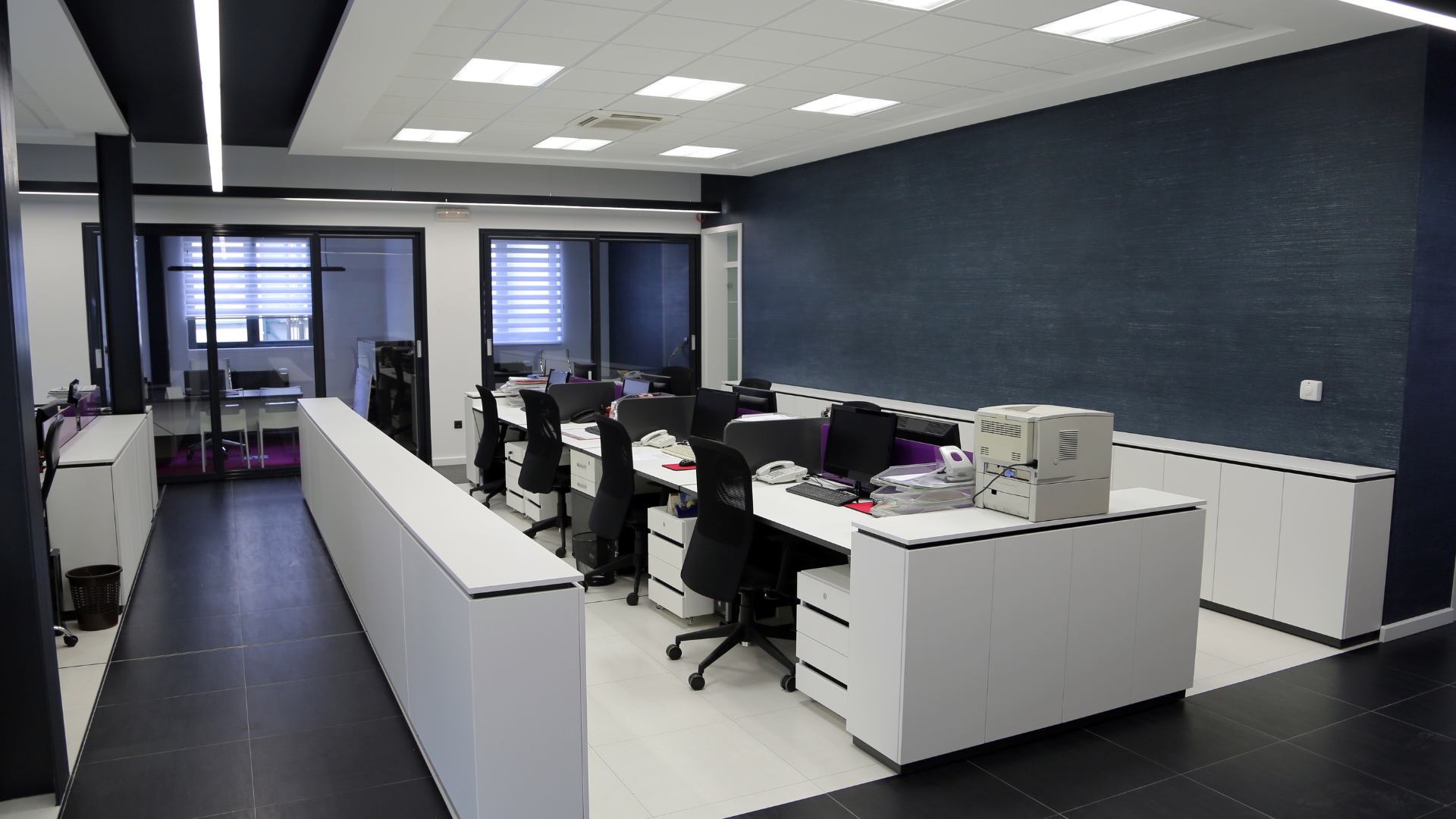 A large office with a lot of desks and chairs
