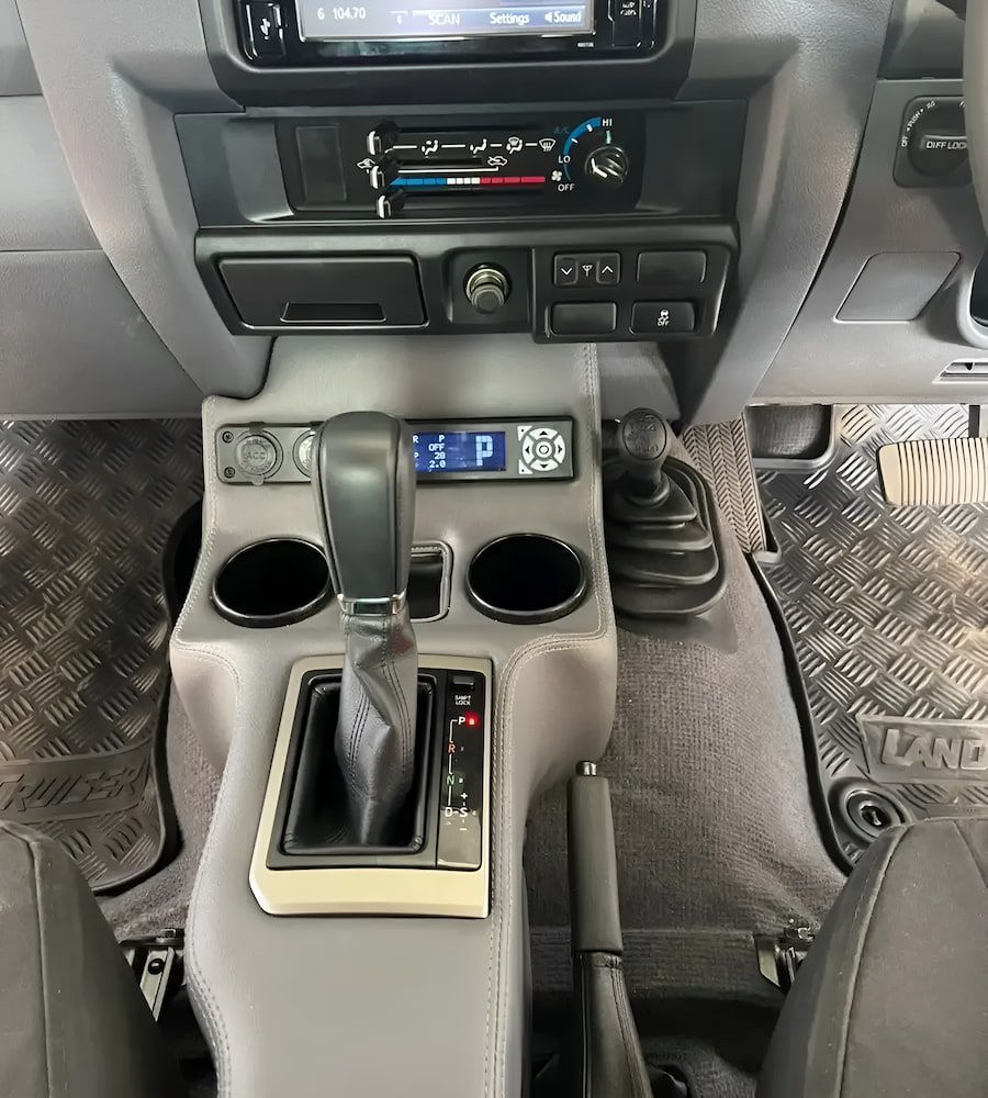 The Interior Of A Car With A Shifter And A Radio — Josh's Diesel Services in Boyne Island, QLD