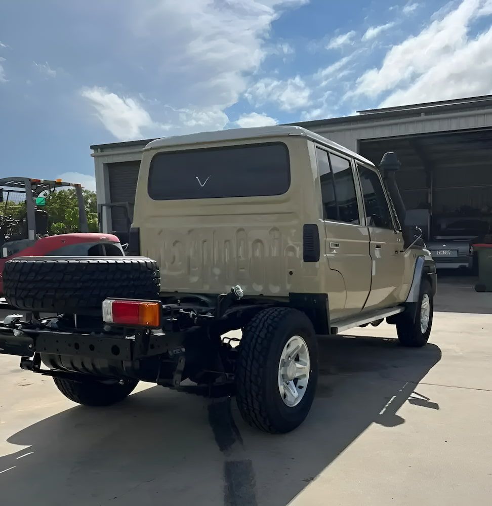 A Toyota Truck Is Parked In Front Of A Garage — Josh's Diesel Services in Boyne Island, QLD