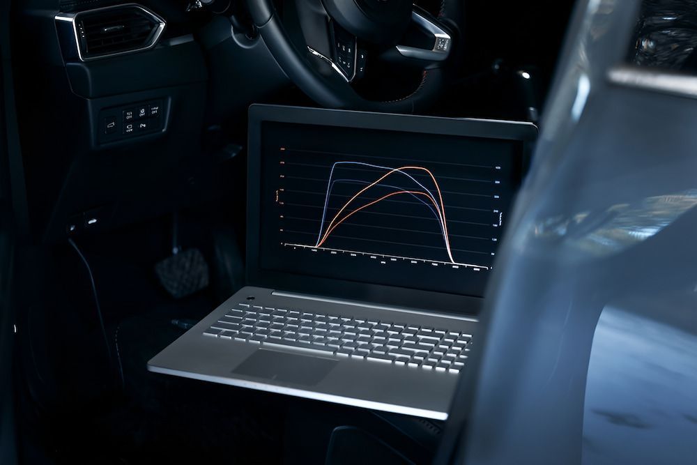 A Laptop Computer Is Sitting Inside Of A Car With A Graph On The Screen — Josh's Diesel Services in Boyne Island, QLD