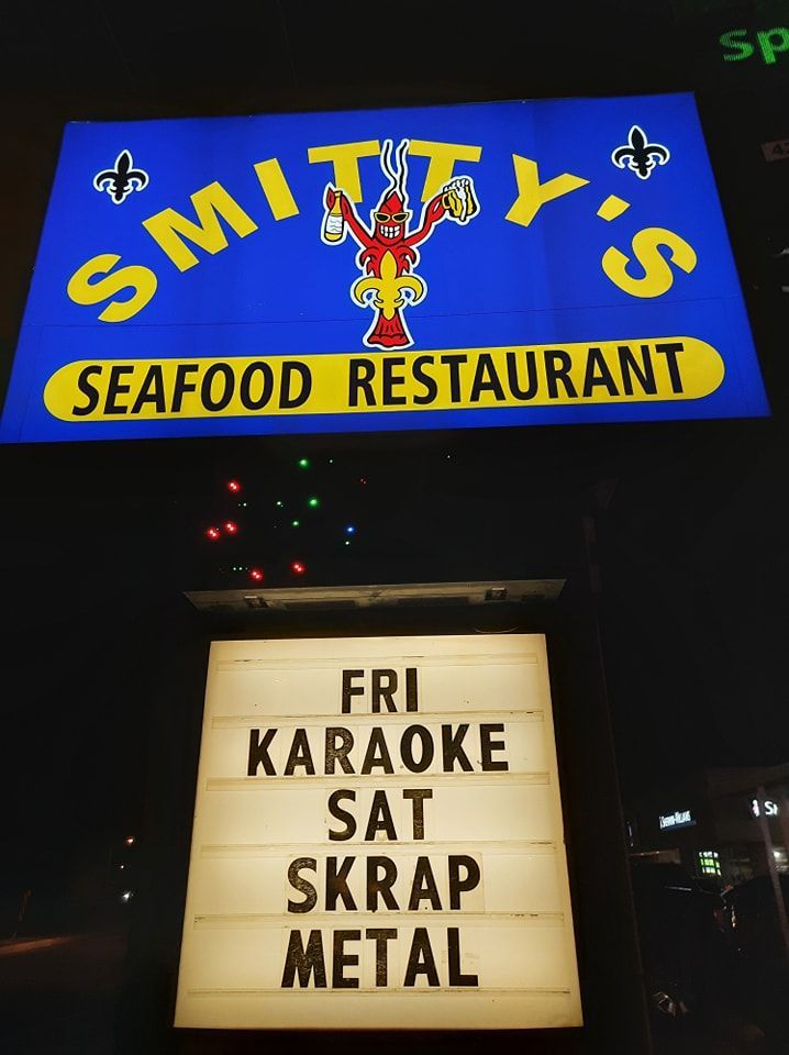 A blue sign for smith 's seafood restaurant