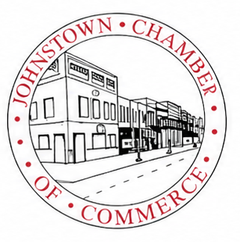 Johnstown Chamber of Commerce circular logo with red text and a black-and-white street scene