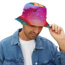 Man wearing a vibrant watercolor bucket hat, denim jacket.