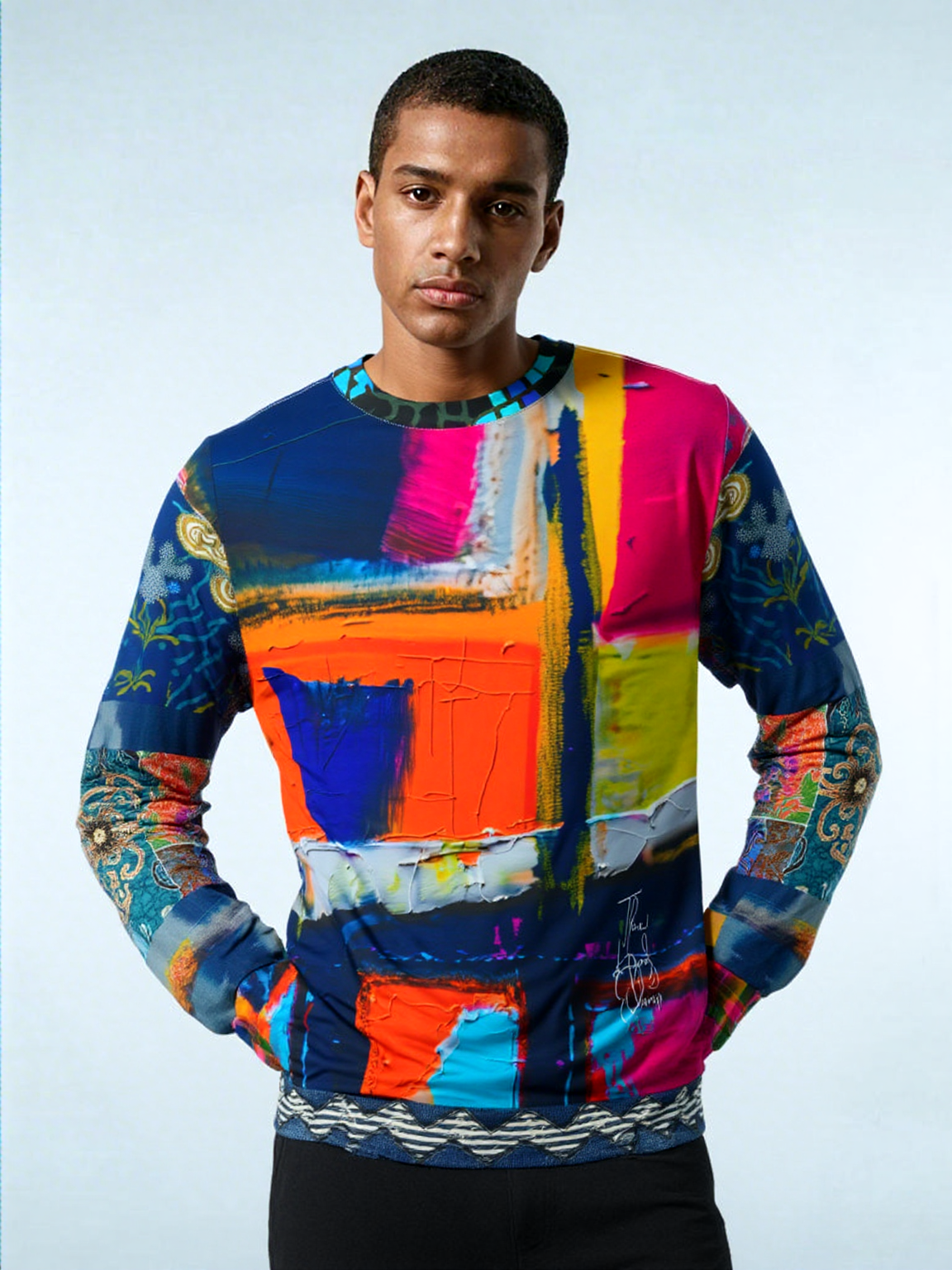 Man wearing colorful abstract print sweater.