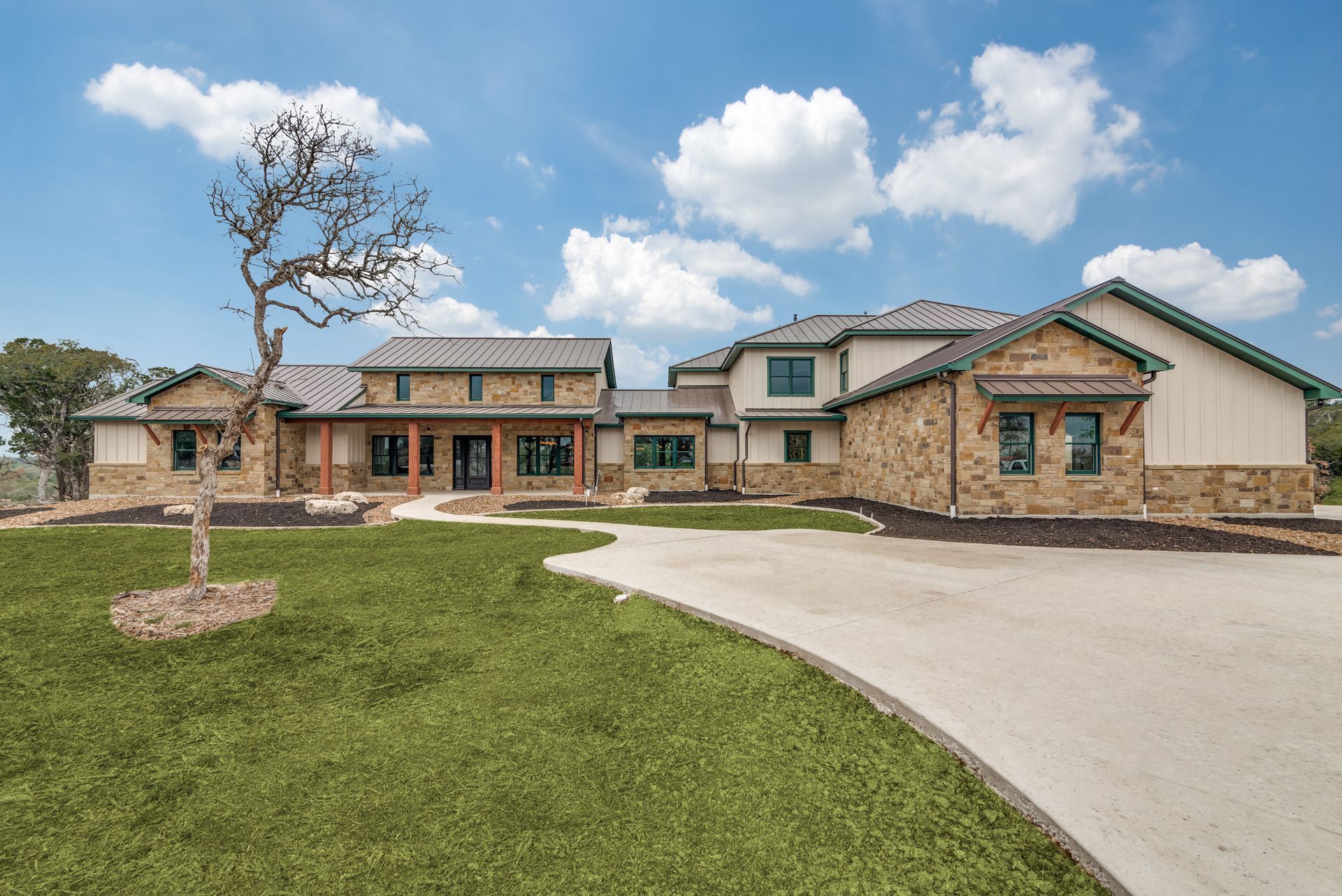 A large house with a tree in front of it