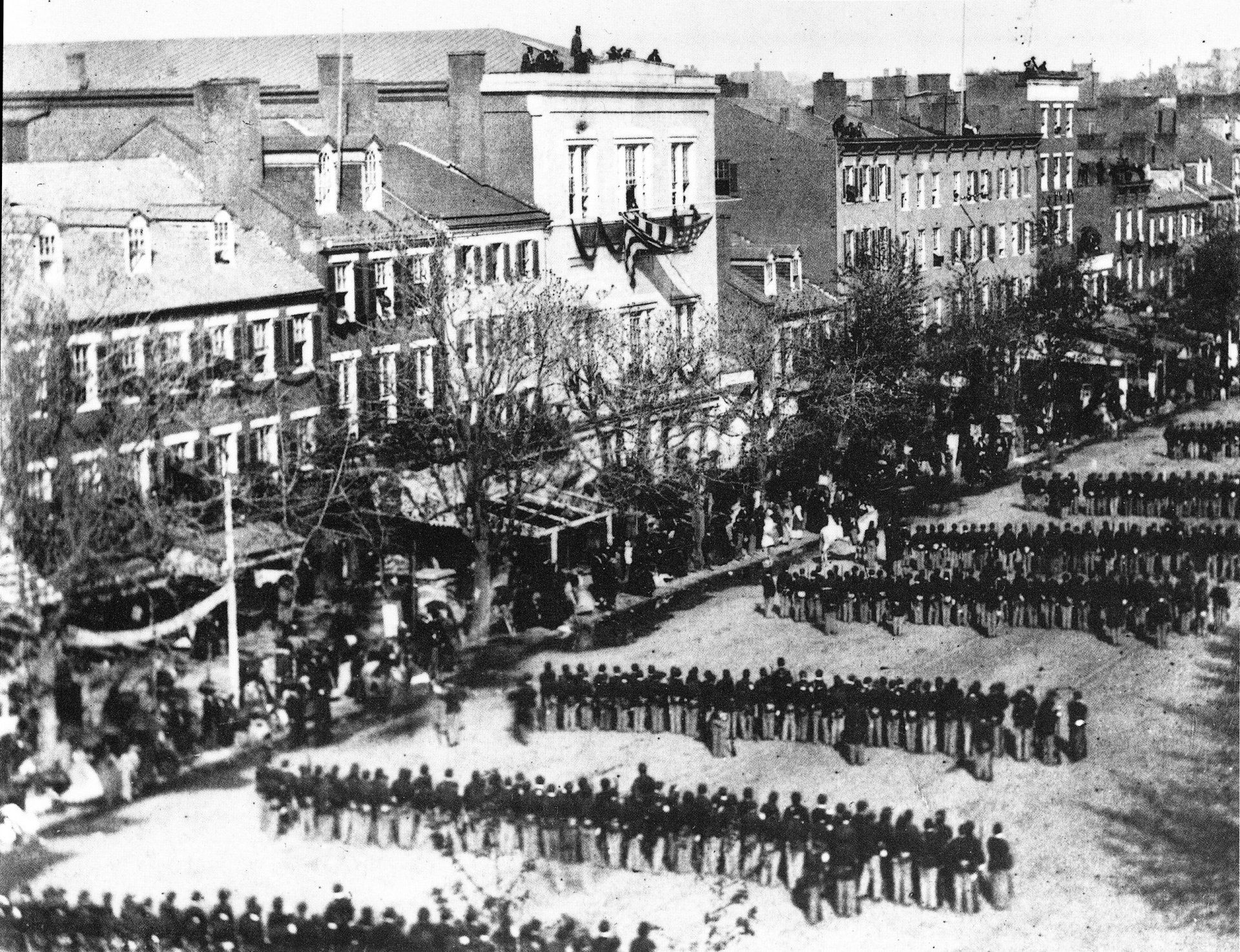 a black and white photo of a military parade
