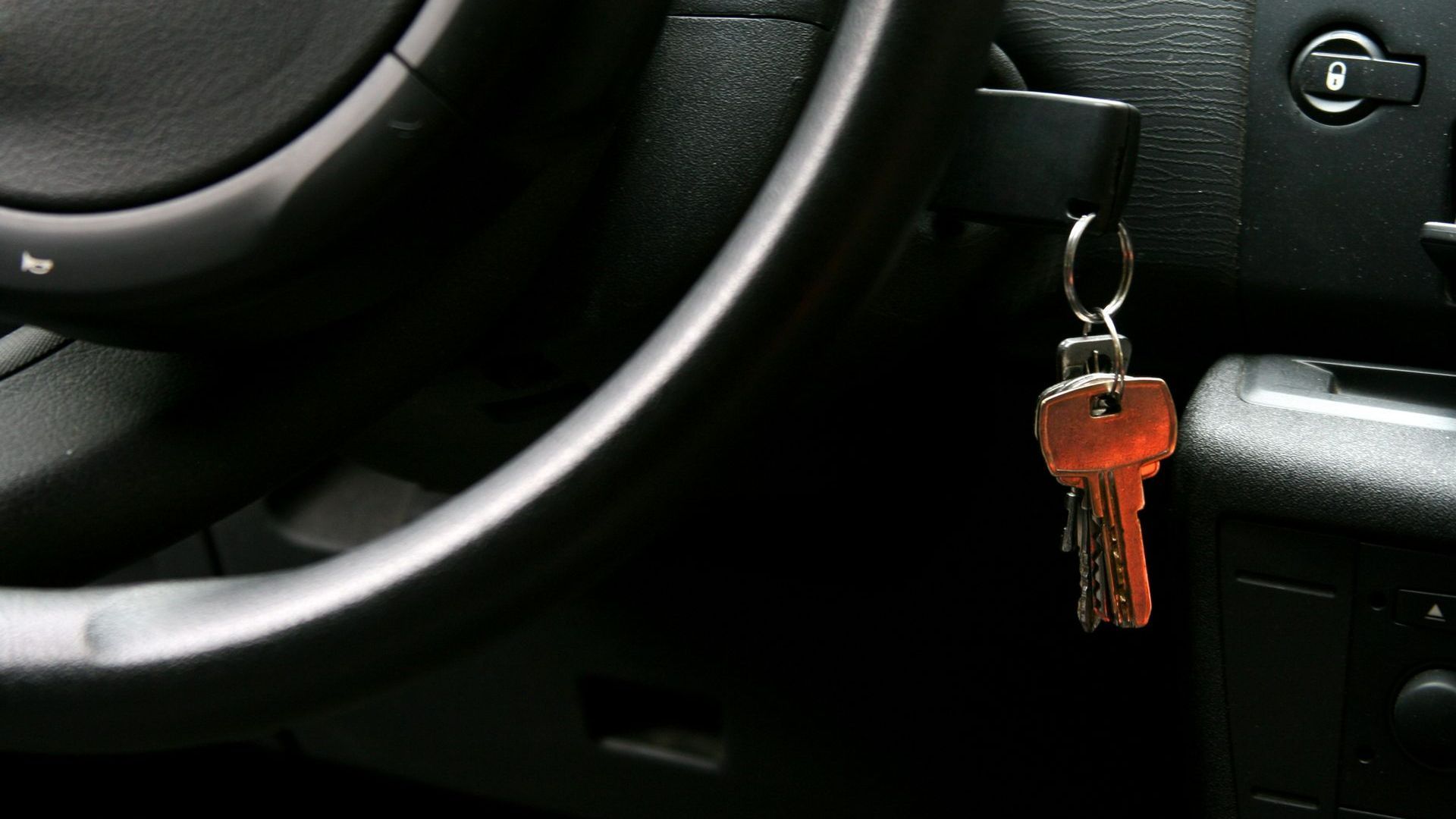 A Car Key Is Hanging from The Steering Wheel | Westminster, CO | M.L. Locksmith A Car Key Is Hanging from The Steering Wheel | Westminster, CO | M.L. Locksmith