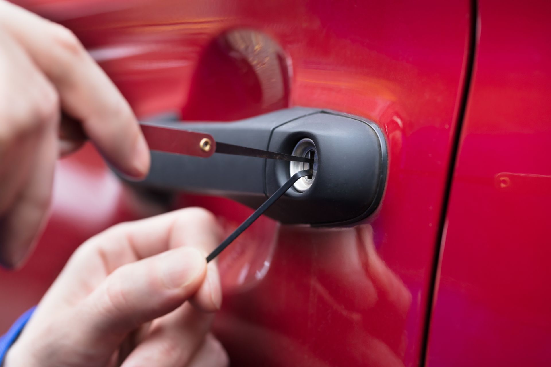 A Person Is Using a Wrench to Open a Car Door | Westminster, CO | M.L. Locksmith A Person Is Using a Wrench to Open a Car Door | Westminster, CO | M.L. Locksmith