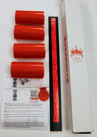 Red target practice kit with four cylinders, a strip, target, instructions, and box.