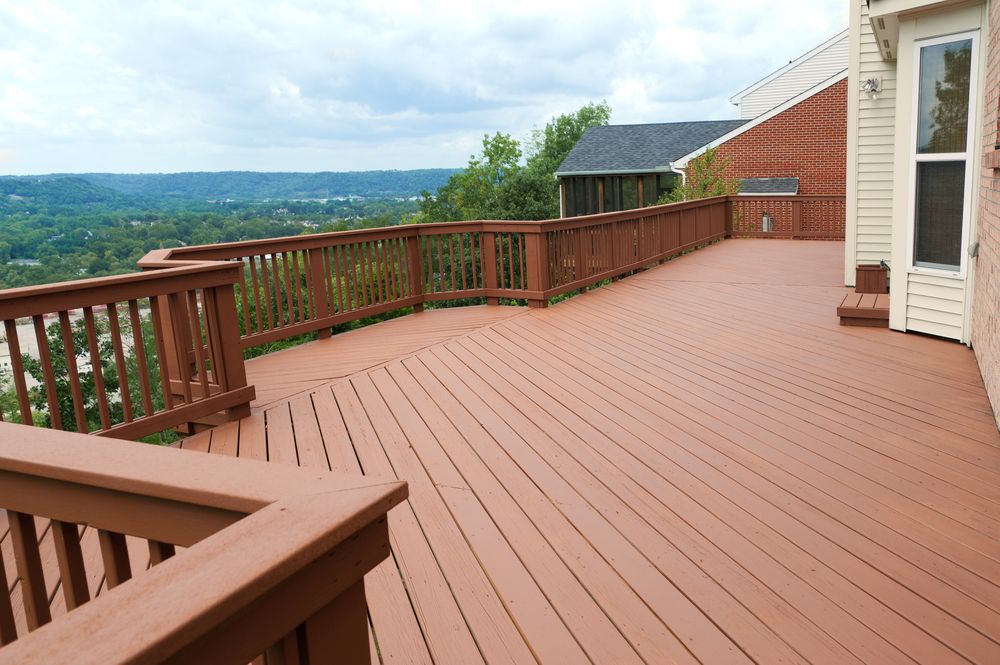 A Large Wooden Deck With a View of a Valley — Norwood Floor Sanding in Ocean Shores, NSW