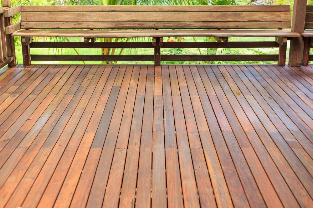 A Wooden Deck With a Bench in the Background — Norwood Floor Sanding in Ocean Shores, NSW