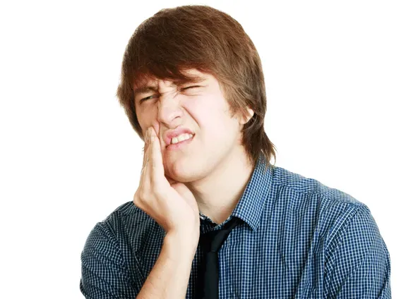 A Man Feeling The Pain On His Teeth — Runcorn, QLD — Runcorn Dental A Man Feeling The Pain On His Teeth — Runcorn, QLD — Runcorn Dental