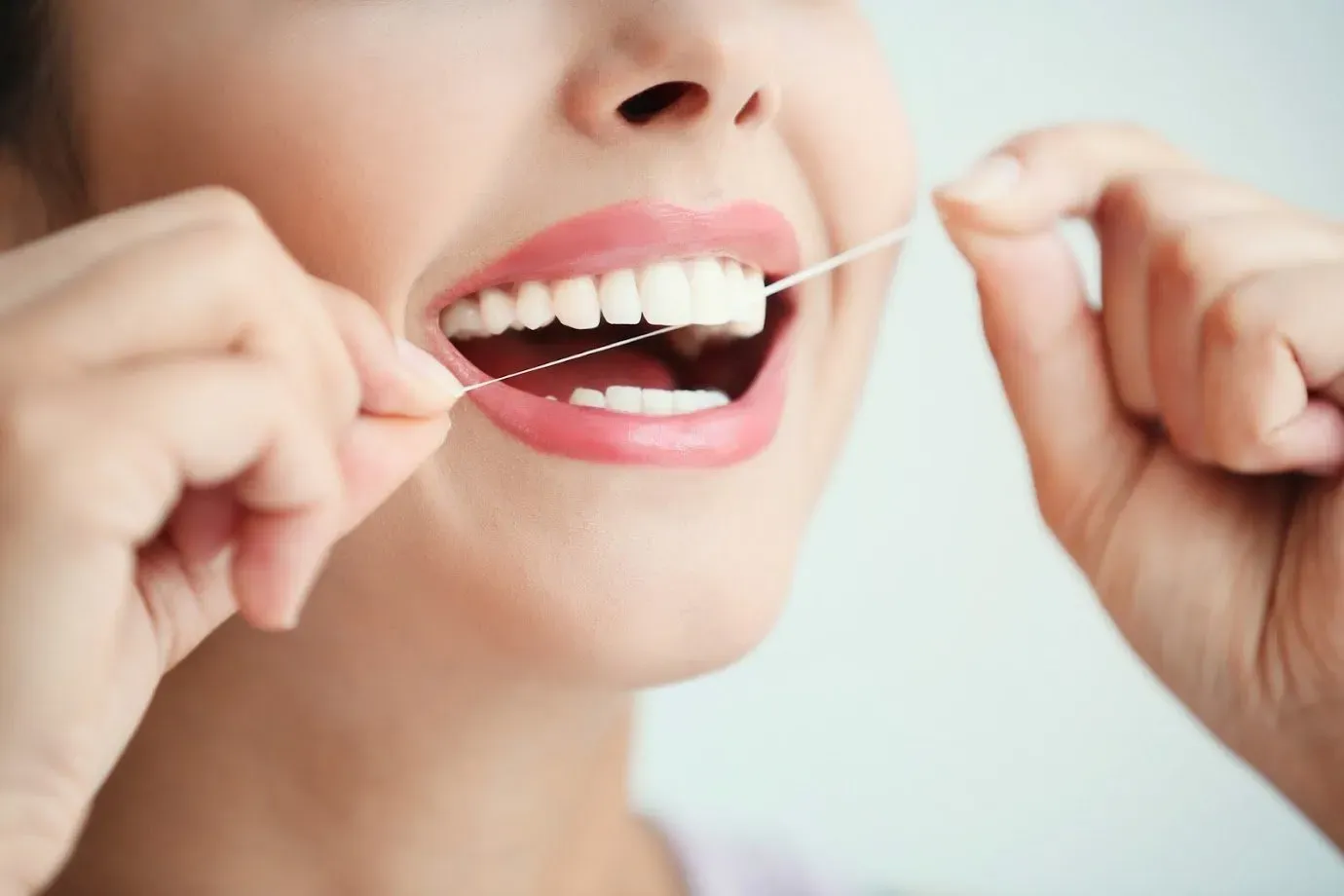 Flossing Her Teeth — Runcorn, QLD — Runcorn Dental