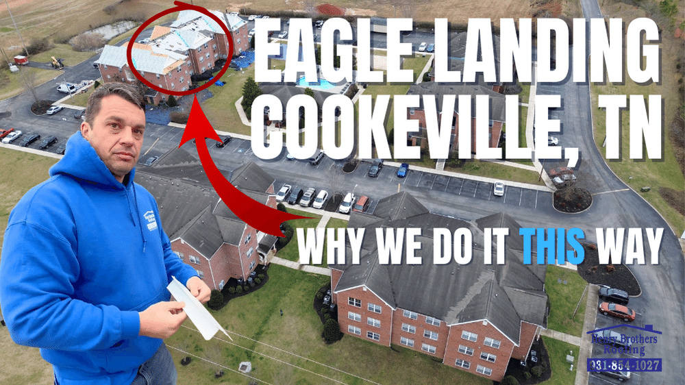 A man in a blue hoodie is standing in front of a building in cookeville tn.