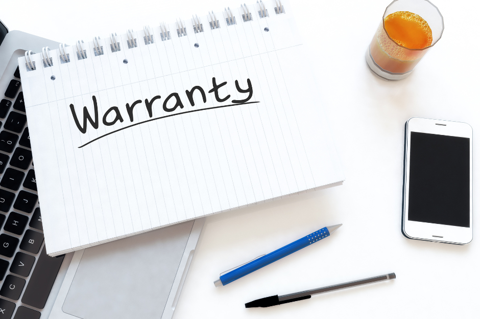 A notebook with the word warranty written on it.
