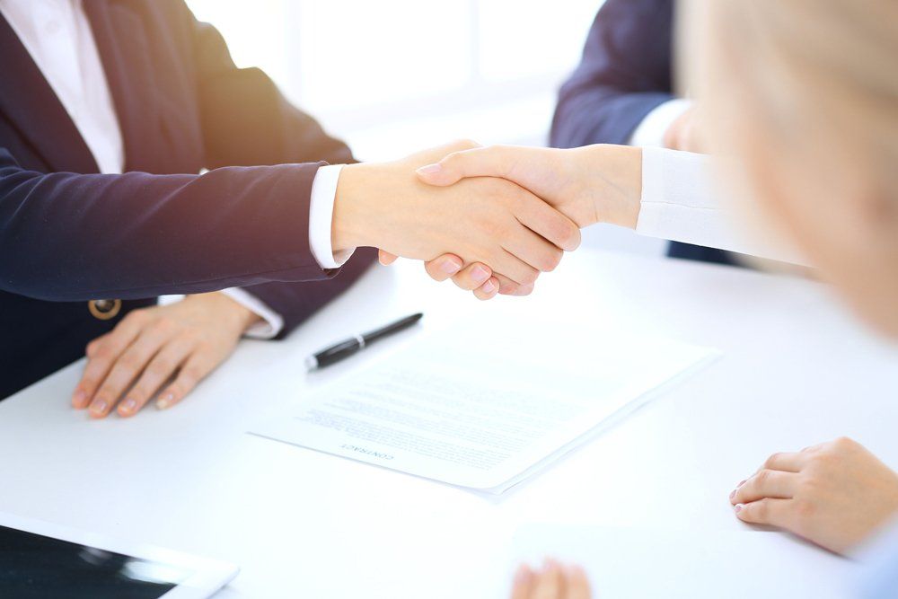 Businessmen Handshaking After Meeting — Greenville, TX — F5 Insurance Solutions