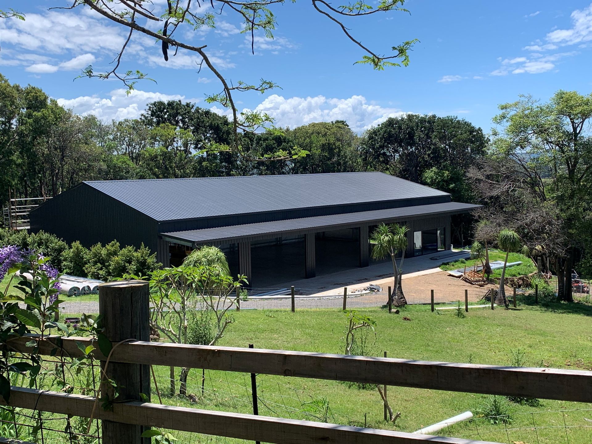 Green Metal Shed With Three Garage Doors, Set on a Rural — Northern Rivers Sheds in South Lismore, NSW