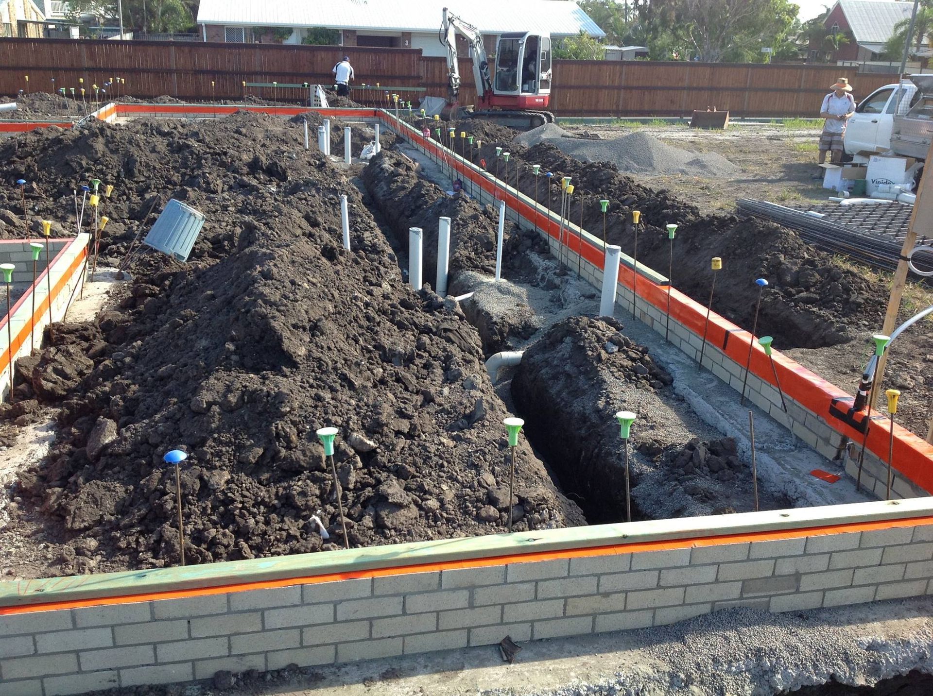 Construction Site With Trenches Soil Piles Brick Foundation and Pipes — All Pest QLD In Sippy Downs, QLD