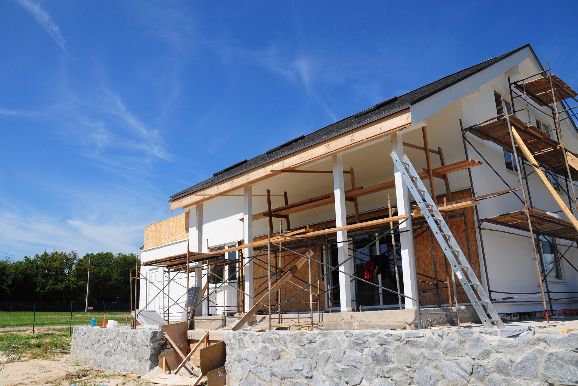 A house is being built with scaffolding around it.