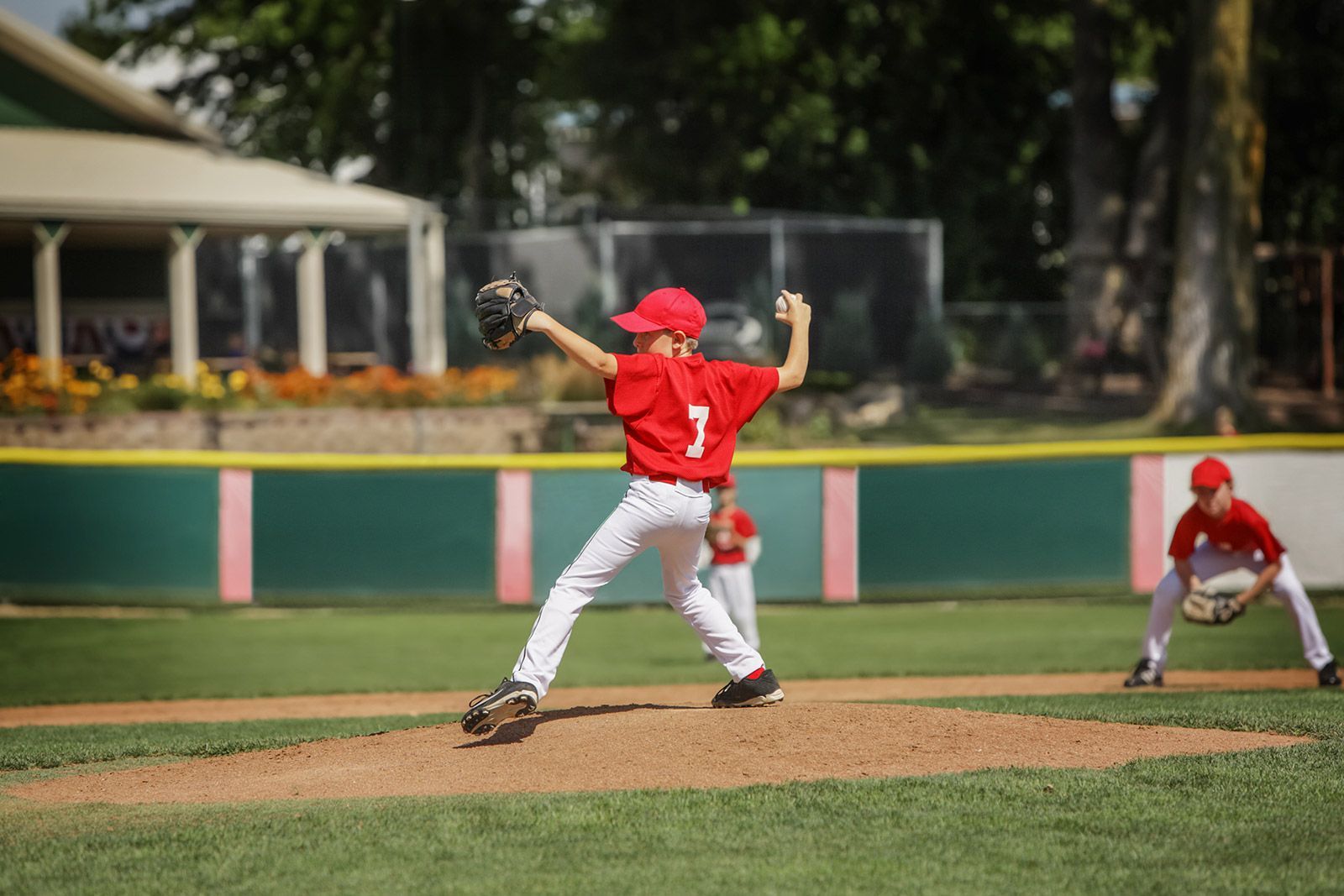 Youth pitcher throwing from the pitchers mound