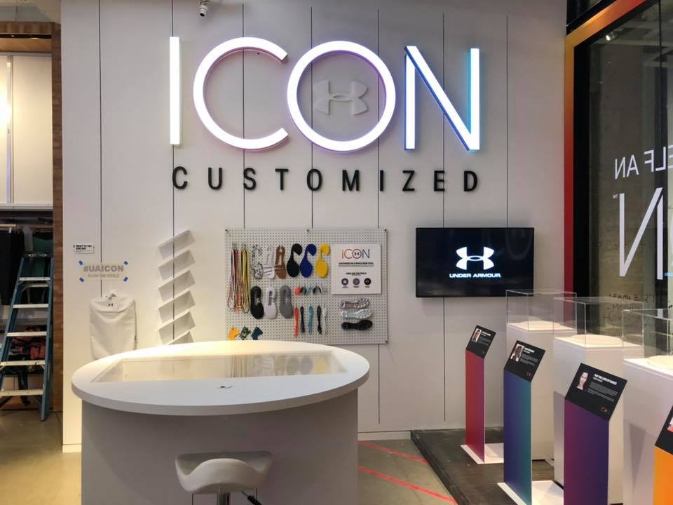 A store with a sign that says icon customized