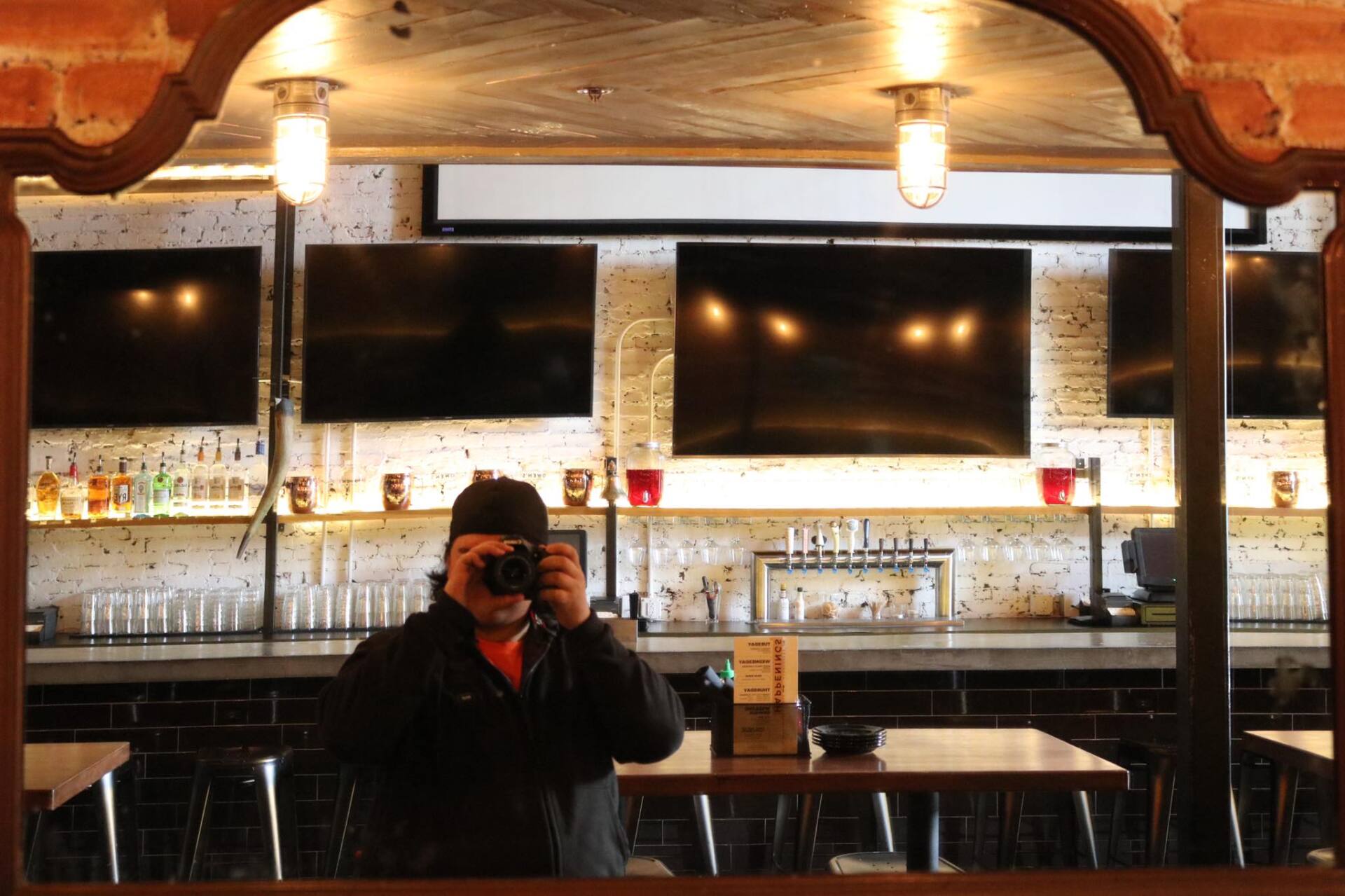 A man is taking a picture of himself in a mirror