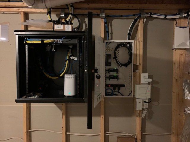 A basement with a lot of wires coming out of it.