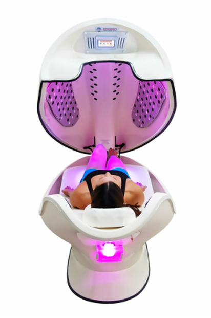 A woman is laying in a chair with the lid open