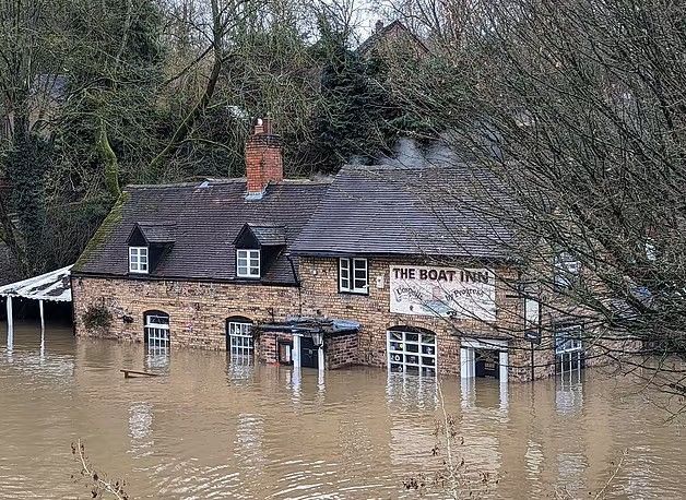 The Boat Inn Shropshire surrounded by water - flood