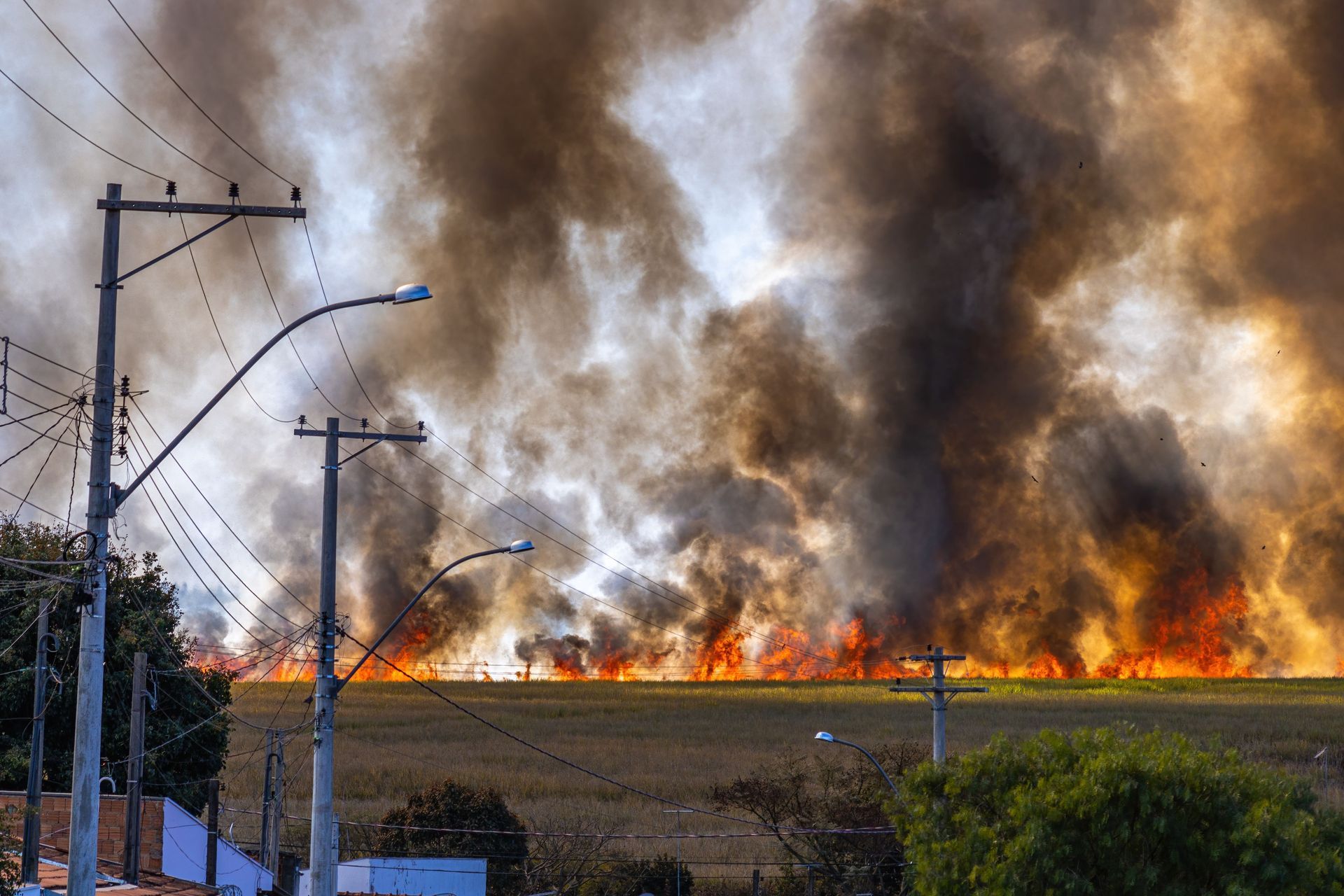 Wildfire burning near power lines in a Utah wildland-urban interface community