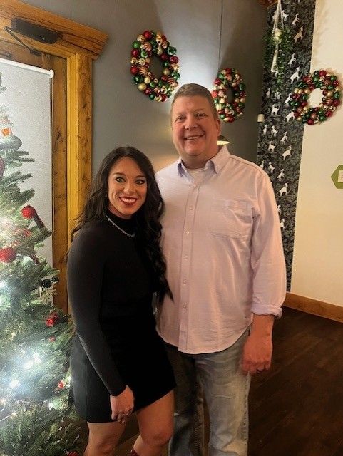 Couple by Christmas tree
