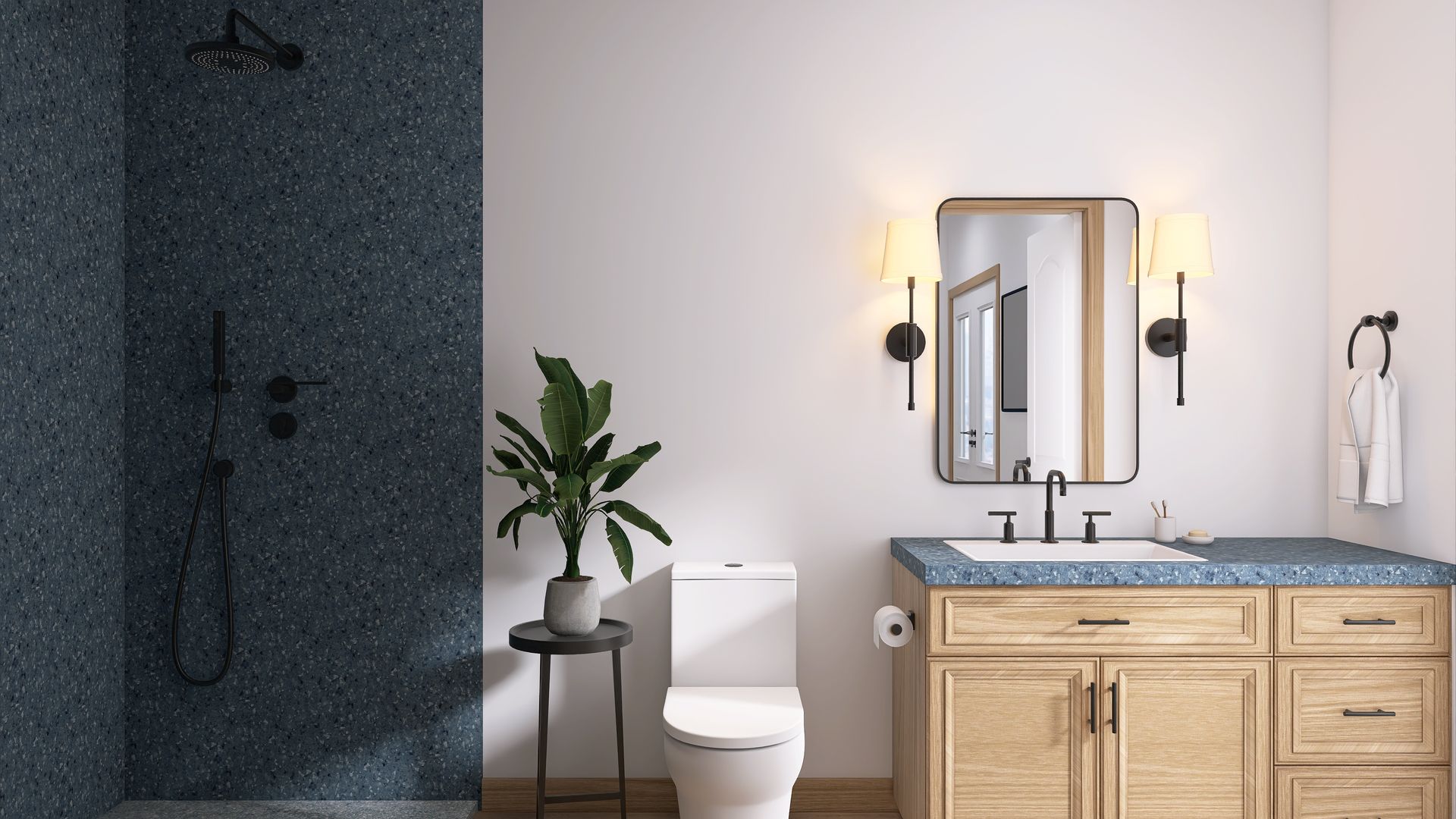 Bathroom with blue speckled shower tile, wooden vanity, and a potted plant.