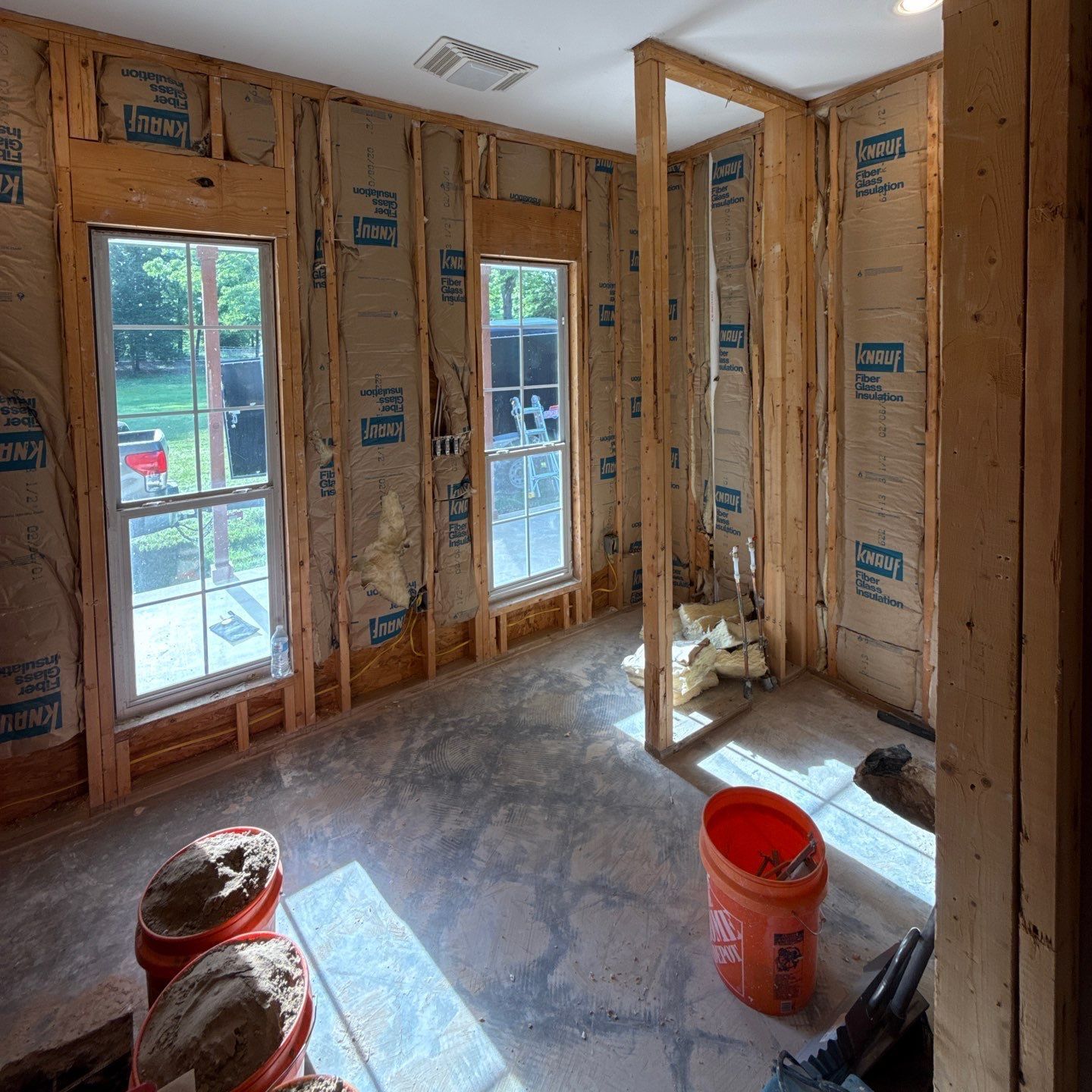 A room that is being built with a lot of insulation on the walls
