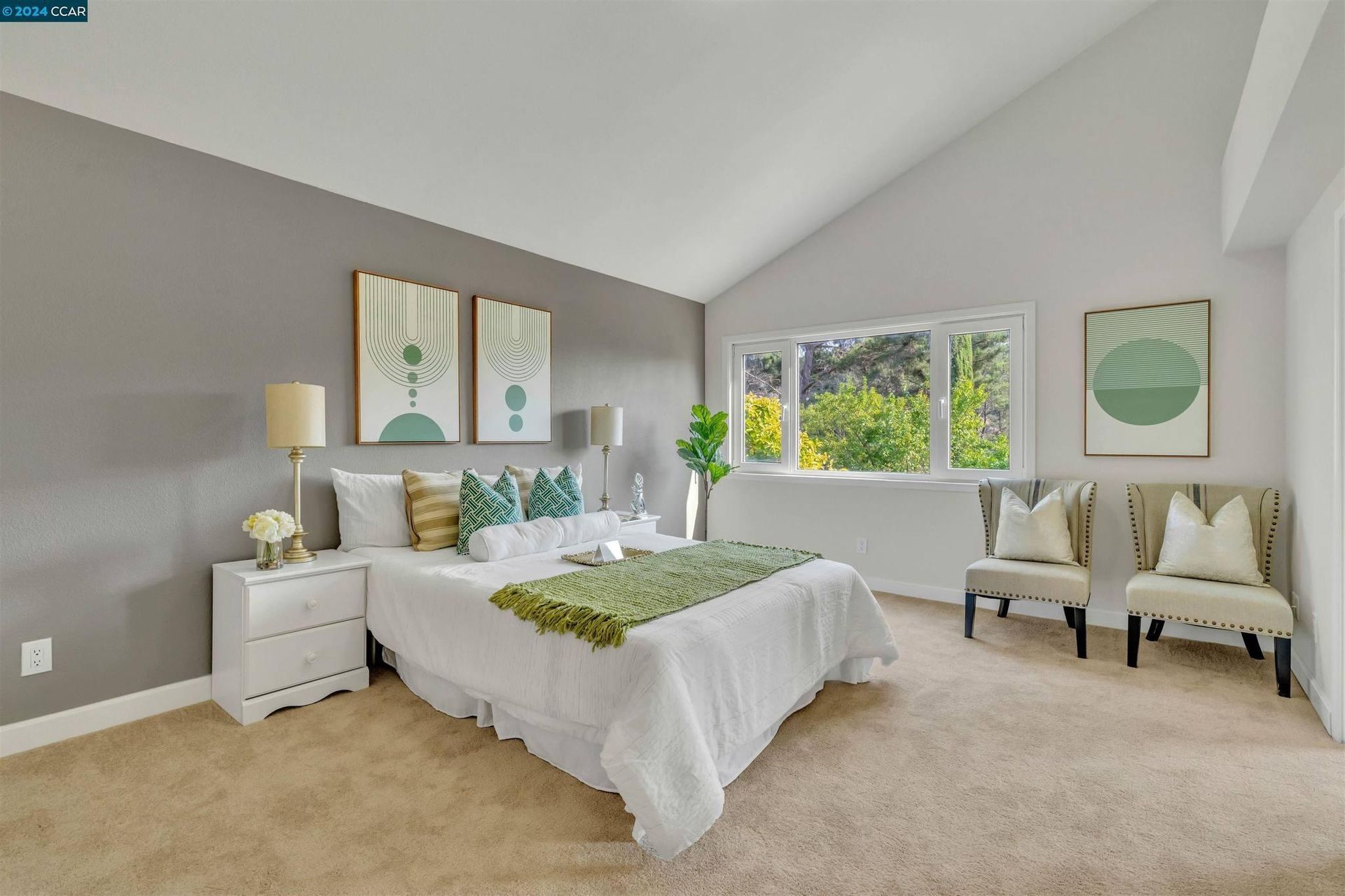 Bedroom with gray walls, white bed, green accents, and large windows.