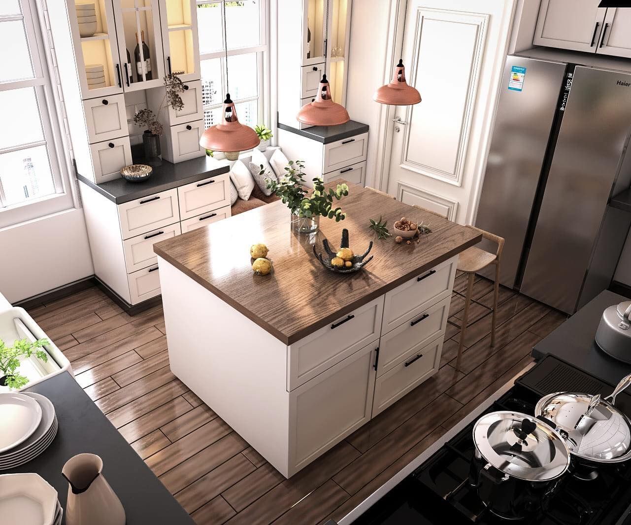 Kitchen interior with a white island and cabinets, wood countertops, and modern pendant lights.