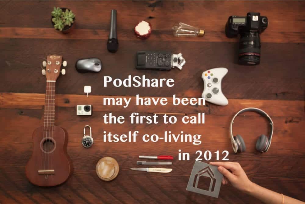 Wooden table with various objects, and text stating PodShare was the first co-living space in 2012.
