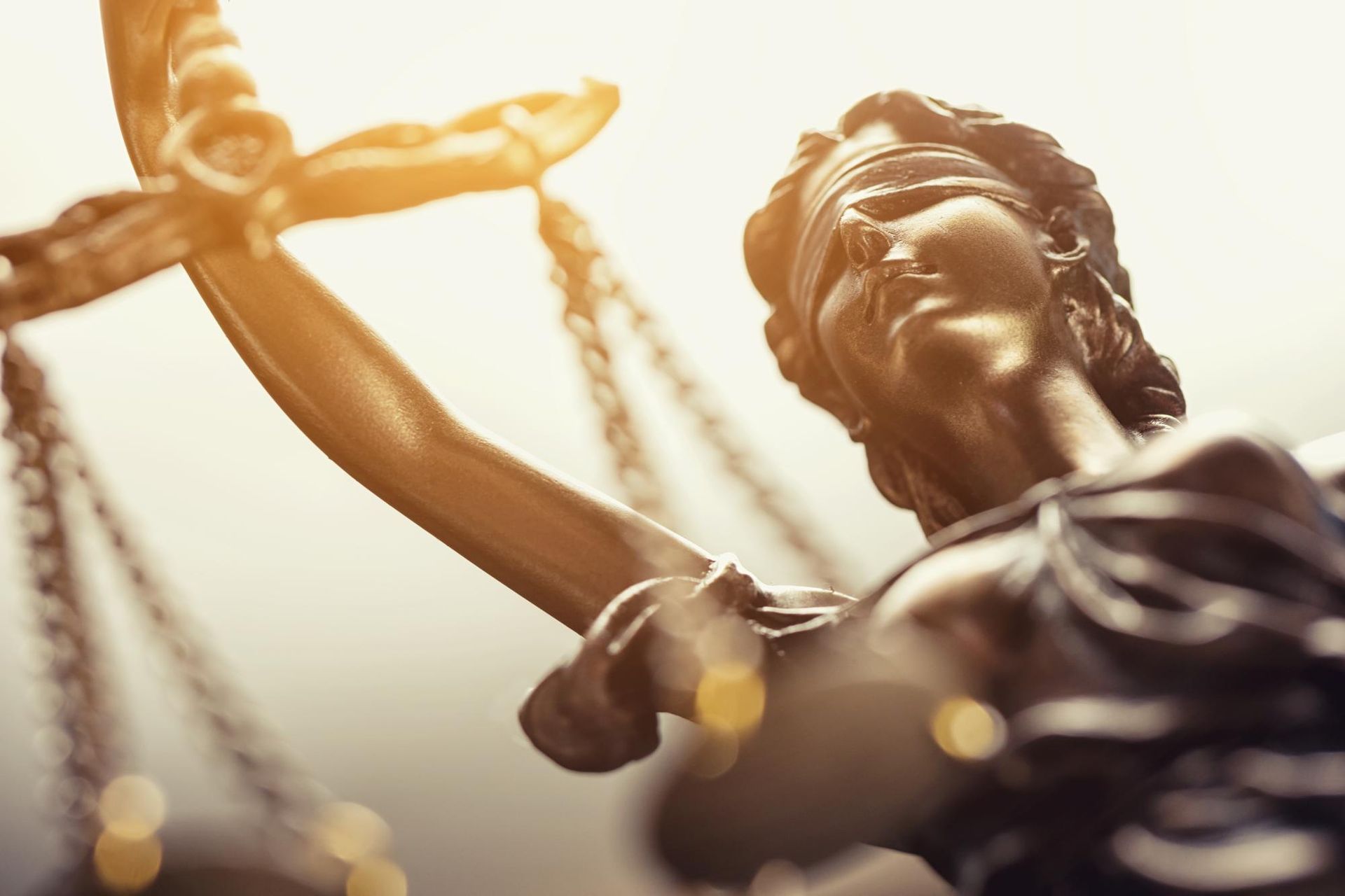 A statue of a woman holding a scale of justice.