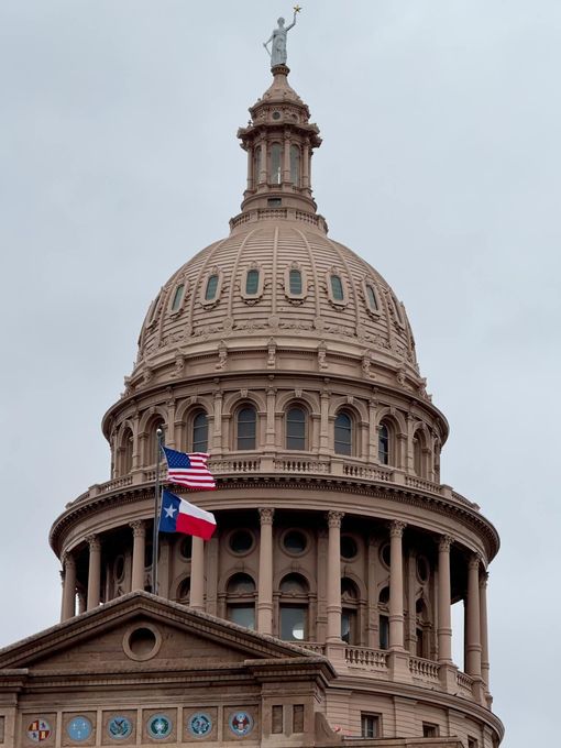 The dome of the texas capitol building has a statue on top of it