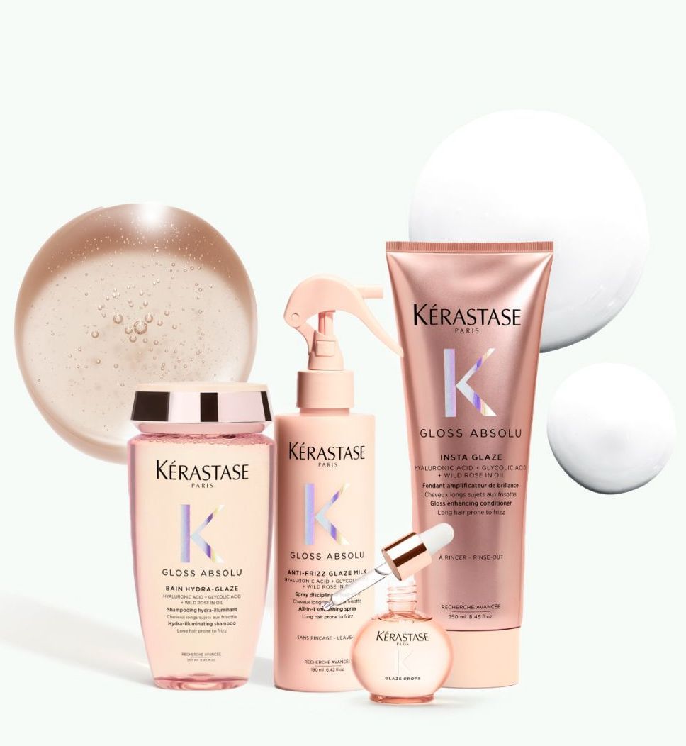 Four kerastase hair products are sitting on a table