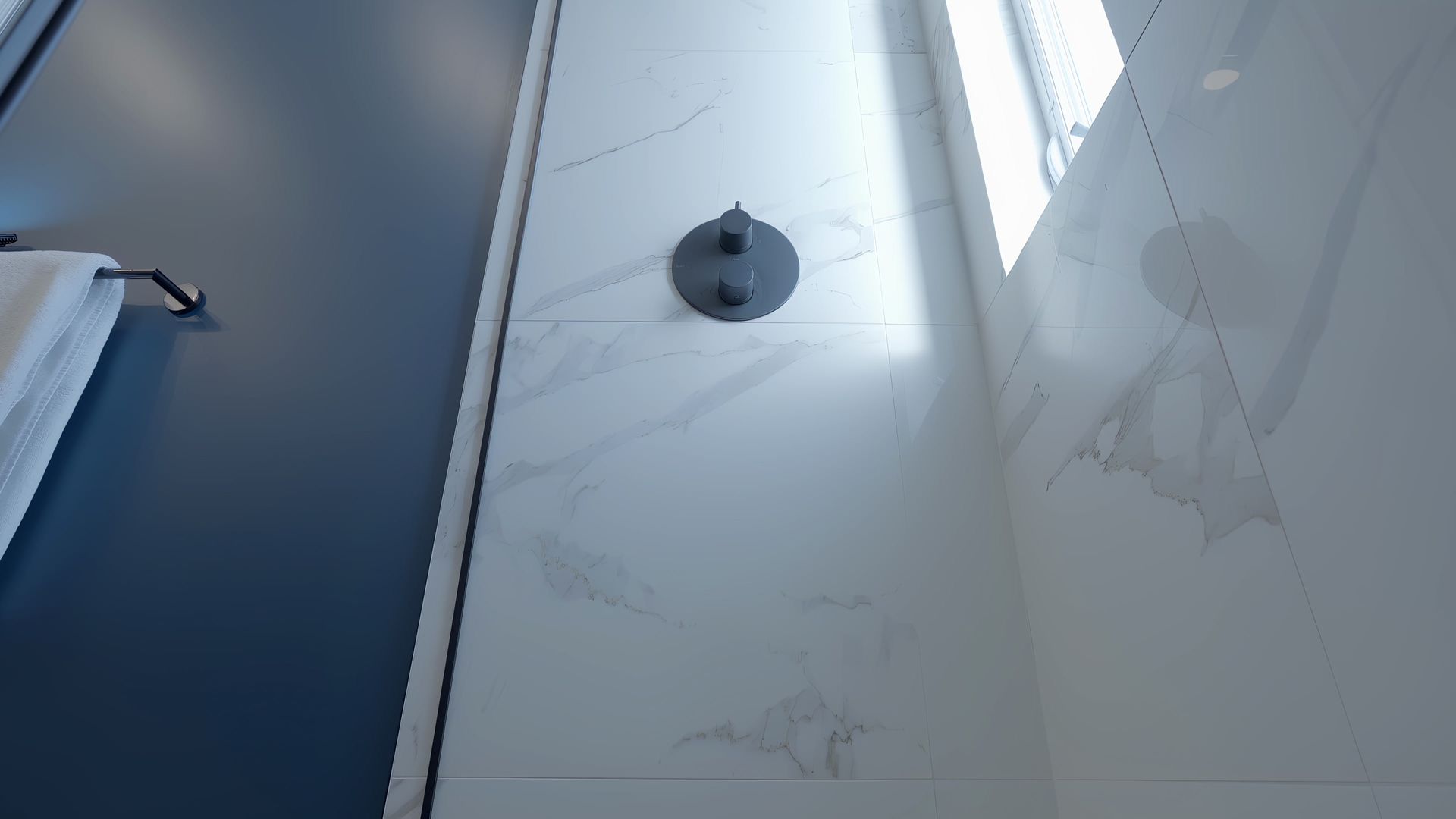 A bathroom with a shower head and a blue wall.